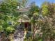 Alluring exterior with lush greenery, charming porch, and bright red door at 374 8Th Ne St, Atlanta, GA 30309