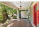 Covered front porch with stone flooring and overhead lighting, perfect for outdoor seating at 374 8Th Ne St, Atlanta, GA 30309