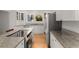 Bright kitchen with granite countertops, stainless steel appliances, and ample white cabinetry at 374 8Th Ne St, Atlanta, GA 30309