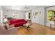 Bright living room featuring hardwood floors, large windows, and a comfortable seating area at 374 8Th Ne St, Atlanta, GA 30309