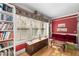 Cozy study with built-in bookshelves, rich red walls, and ample natural light at 374 8Th Ne St, Atlanta, GA 30309