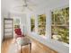 Bright sunroom with hardwood floors, large windows, recessed lighting and white walls at 374 8Th Ne St, Atlanta, GA 30309