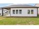 View of the house from the backyard, featuring well-maintained lawn and neutral siding at 7757 Sheffield Ter, Fairburn, GA 30213