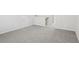 Basement area featuring neutral carpeting and bright white walls at 7757 Sheffield Ter, Fairburn, GA 30213