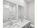 Bathroom featuring double sinks, grey cabinets and white countertops at 7757 Sheffield Ter, Fairburn, GA 30213