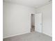 Neutral bedroom with gray carpet and two white doors at 7757 Sheffield Ter, Fairburn, GA 30213