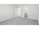 Bright bedroom with neutral carpet and a view of the ensuite bathroom at 7757 Sheffield Ter, Fairburn, GA 30213