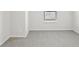 Bedroom with neutral carpet, a window with blinds, and white walls at 7757 Sheffield Ter, Fairburn, GA 30213
