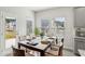 Bright dining area with modern furnishings and a view of the neighborhood at 7757 Sheffield Ter, Fairburn, GA 30213