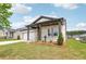 Single-story home with well-manicured lawn and landscaping, including a view of the house number at 7757 Sheffield Ter, Fairburn, GA 30213