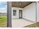 Covered patio area with view of the backyard at 7757 Sheffield Ter, Fairburn, GA 30213