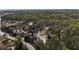 Neighborhood view with mature trees and winding roads in a suburban setting at 3318 Monceau Way, Roswell, GA 30075