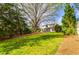 Expansive lawn area and view of the house from the rear of the property at 3318 Monceau Way, Roswell, GA 30075