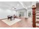 Spacious basement with wood flooring, staircase and separate game areas at 3318 Monceau Way, Roswell, GA 30075