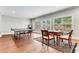 Basement with ping pong and game table and dining area with view of backyard at 3318 Monceau Way, Roswell, GA 30075