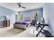 Comfortable bedroom with light blue walls, a ceiling fan, and neutral carpet at 3318 Monceau Way, Roswell, GA 30075