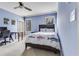 Bedroom with fish-themed bedding and a fan at 3318 Monceau Way, Roswell, GA 30075