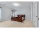 Minimalist bedroom featuring neutral carpet, grey walls, and an unfinished bed frame at 3318 Monceau Way, Roswell, GA 30075