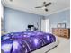 Spacious bedroom with light blue walls, a ceiling fan, and neutral carpet at 3318 Monceau Way, Roswell, GA 30075