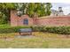 Welcoming entrance to Tiffany Place with brick signage, landscaping, and bench seating at 3318 Monceau Way, Roswell, GA 30075