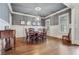 Elegant dining room with hardwood floors, wainscoting, and a stylish chandelier at 3318 Monceau Way, Roswell, GA 30075