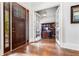 Grand foyer featuring hardwood floors, French doors, and a view into a well-appointed office at 3318 Monceau Way, Roswell, GA 30075