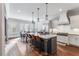 Open-concept kitchen with a large island, modern appliances, and an adjacent dining area at 3318 Monceau Way, Roswell, GA 30075