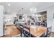 Bright, open kitchen with an island, stainless appliances, and a view into the living room at 3318 Monceau Way, Roswell, GA 30075