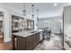 Spacious kitchen featuring an island with seating, stainless steel appliances, and ample cabinet space at 3318 Monceau Way, Roswell, GA 30075