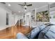Spacious upstairs living room with hardwood floors, built-in shelving, and a blue sofa at 3318 Monceau Way, Roswell, GA 30075