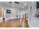 Upstairs living room with hardwood floors, built-in shelving, and an open floor plan at 3318 Monceau Way, Roswell, GA 30075