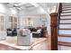 Open-concept living room with comfortable seating and natural light at 3318 Monceau Way, Roswell, GA 30075