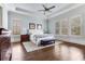 Spacious main bedroom with tray ceilings, hardwood floors, and plenty of natural light at 3318 Monceau Way, Roswell, GA 30075