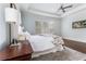 Spacious main bedroom with tray ceilings, hardwood floors, and plenty of natural light at 3318 Monceau Way, Roswell, GA 30075