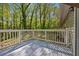 The backyard deck is framed by mature trees at 3690 Asbury Sw Ln, Atlanta, GA 30331