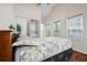Spacious main bedroom with vaulted ceiling, windows, a laundry closet, and natural light at 3690 Asbury Sw Ln, Atlanta, GA 30331