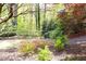 This home boasts a private backyard with lush greenery, mature trees, and colorful plants, creating a peaceful retreat at 4579 Blakedale Ne Cir, Roswell, GA 30075