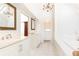 Bright bathroom features soaking tub, double vanity, and dressing area at 4579 Blakedale Ne Cir, Roswell, GA 30075