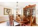 Formal dining room featuring a crystal chandelier, and large wood table and chairs at 4579 Blakedale Ne Cir, Roswell, GA 30075