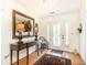Inviting foyer with white trim, hardwood floors, and glass-paneled front door at 4579 Blakedale Ne Cir, Roswell, GA 30075