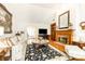Spacious living room boasting hardwood floors, fireplace, large windows and elegant furnishings at 4579 Blakedale Ne Cir, Roswell, GA 30075