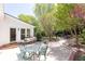 The home features a charming patio with views of the beautifully landscaped backyard with mature trees and plantings at 4579 Blakedale Ne Cir, Roswell, GA 30075