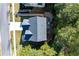 Aerial view of the home showing the roof, driveway and backyard at 6424 Barker Station Walk, Sugar Hill, GA 30518