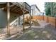 Backyard with stone path to door and stairs to deck at 6424 Barker Station Walk, Sugar Hill, GA 30518
