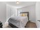 Cozy bedroom with carpet, a queen-sized bed and neutral-colored walls at 6424 Barker Station Walk, Sugar Hill, GA 30518