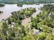 Lakefront property boasts private lake access and lush surroundings, perfect for serene waterfront living at 125 Mayo Rd, Covington, GA 30014