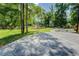 Backyard features an expansive stamped concrete patio overlooking a private yard with mature trees at 125 Mayo Rd, Covington, GA 30014