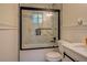 Bathroom featuring modern shower with black frame and glass enclosure and matching vanity with black hardware at 125 Mayo Rd, Covington, GA 30014