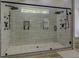 Modern walk-in shower featuring two shower heads, custom tile work, and pebble floor at 125 Mayo Rd, Covington, GA 30014