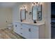 Bathroom featuring a double sink vanity with modern lighting and fixtures at 125 Mayo Rd, Covington, GA 30014